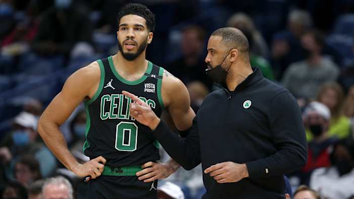 Boston Celtics head coach Ime Udoka (right) talks to forward Jayson Tatum.
